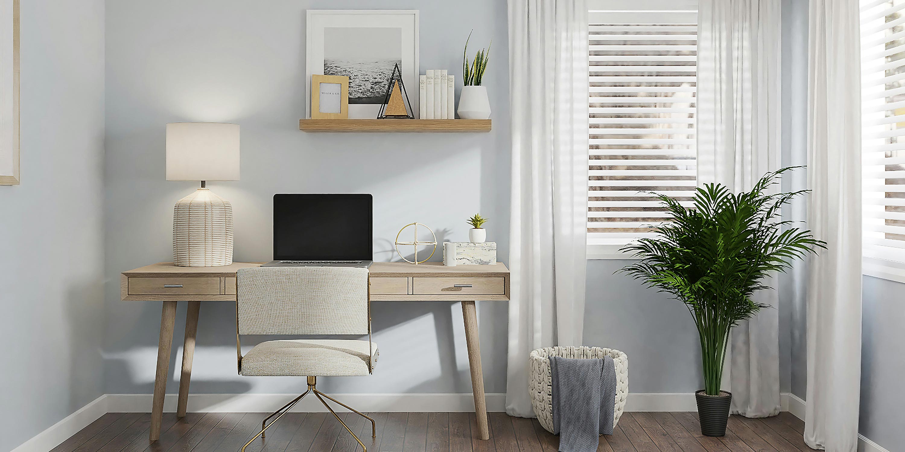 Minimalist home office with a wooden desk, laptop, and indoor plant