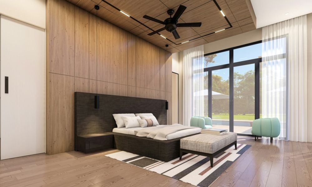 Contemporary bedroom with wood accent wall, large windows, and soft natural lighting